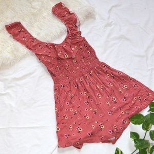 Pink romper with flower pattern